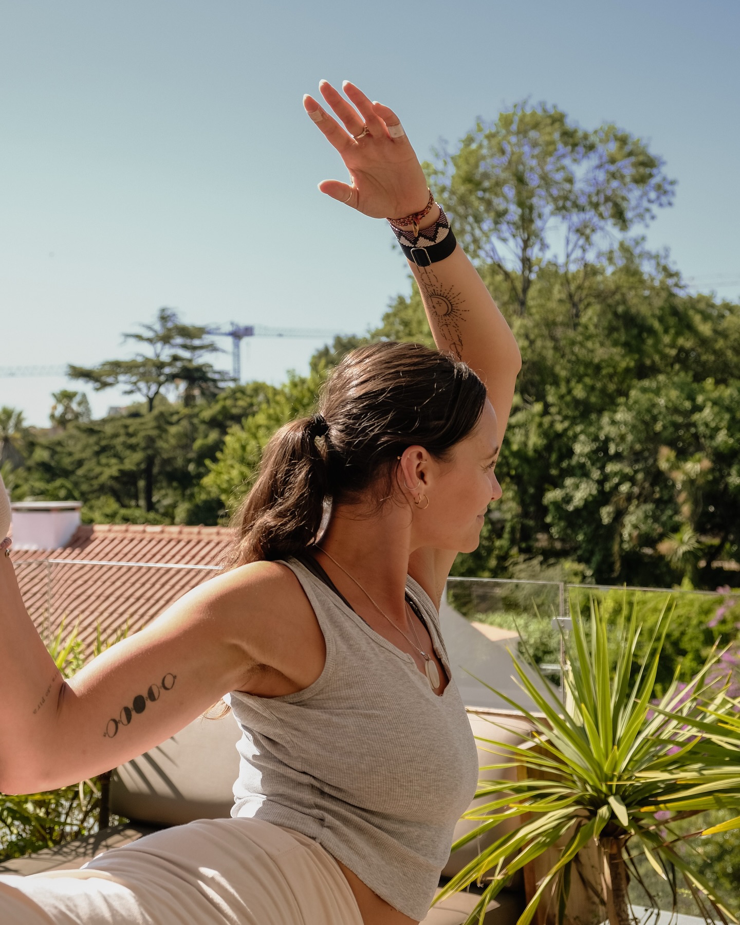 Sunlit rooftop terrace yoga practice in Lisbon